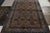 Hand-knotted in wool, a 7x11 antique Persian rug from Tehran showcasing fine craftsmanship of the 1920s with royal blue,...