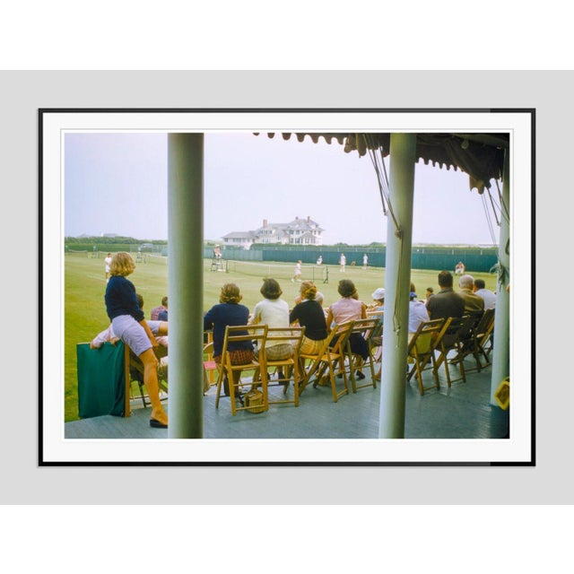 The Meadow Club by Toni Frissell Spectators watch a lawn tennis match at The Meadow Club, an exclusive, historic private...