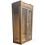 A tall wooden display cabinet with a warm natural finish and two glass-paneled doors. The clean rectangular shape and...