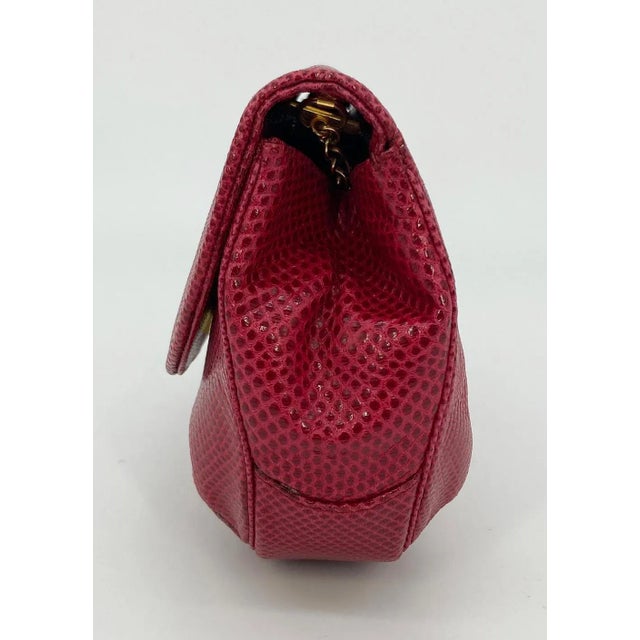 Judith Leiber Red Lizard Tassel Charm Strap Clutch Handbag in fair vintage condition. Red lizard leather trimmed with...