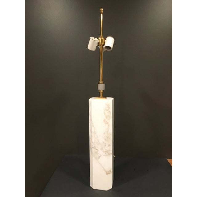 Elegant in its simplicity, this square lamp with beveled corners is constructed from Calacatta Gold marble and has brass...