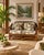 Beautiful vintage loveseat featuring a sculptural rattan frame with intricate woven details and leather-wrapped joints....