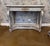 This elegant Early 19th century Swedish-style console table features a classic, curved silhouette with a distressed...