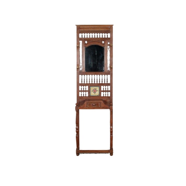 This Vintage Indian Painted Teakwood Hall Stand with Mirror is handcrafted from solid teakwood, featuring a tall mirrored...
