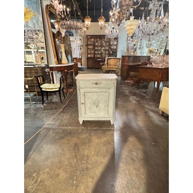 This Early 20th c. Swedish Painted Side Cabinet is a charming piece of furniture that adds a touch of charm to any home....
