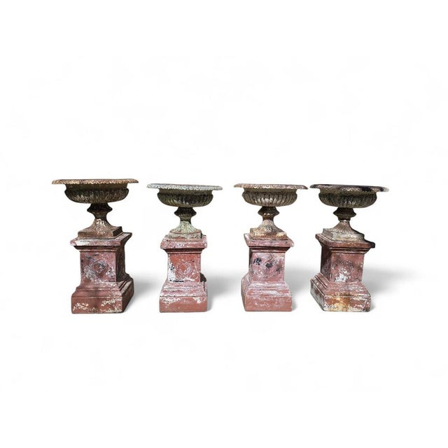 Important set of four monumental garden urns, crafted in France in the 19th century, combining cast iron vases with their...