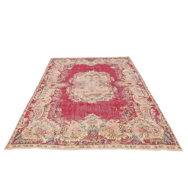 Handknotted vintage decorative wool rug from Oushak region of Turkey. Approximately 50-60 years old. In very good condition.