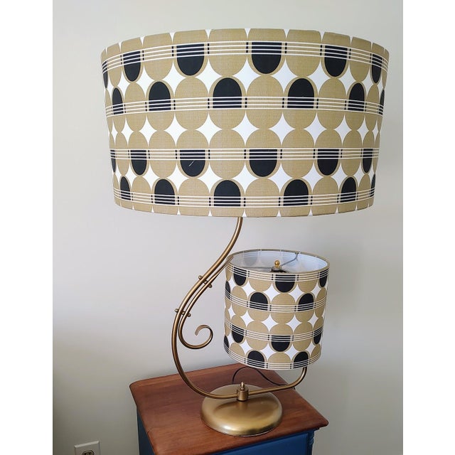 Unique two tiered MCM Lamp. Lamp shades have been handmade with a retro pattern to match the lamp. There are two switches,...