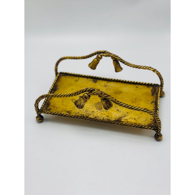 A decorative vintage Italian gilt metal tray, beautifully fashioned with twisted rope borders and whimsical tassel motifs...