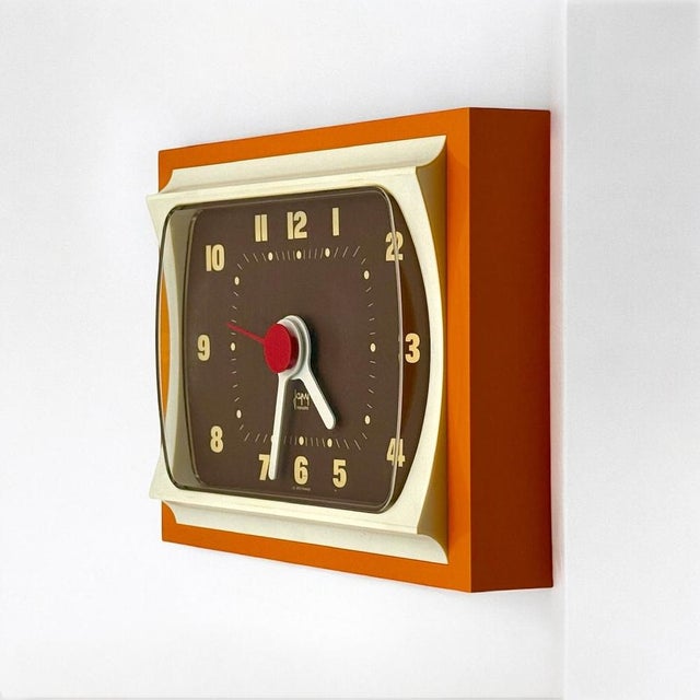 Striking 70s space age clock by Japy France. Featuring a large rectangular frame softened by curvaceous edges, it sports a...