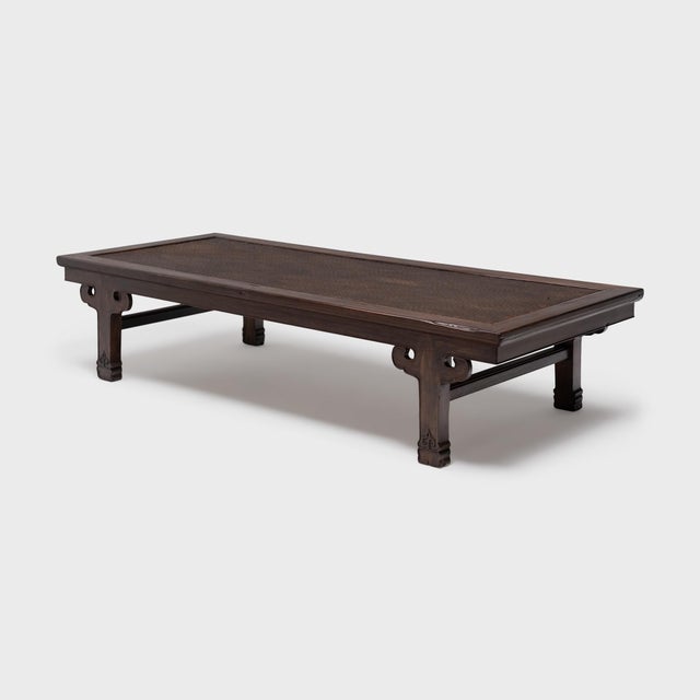 Distinguished by its fine materials and balanced proportions, this antique Chinese daybed was masterfully crafted with an...