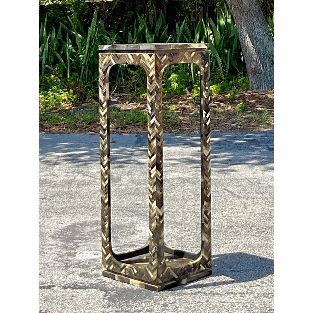 Make a bold and exotic statement with this striking vintage coastal pedestal, meticulously crafted from tessellated horn...