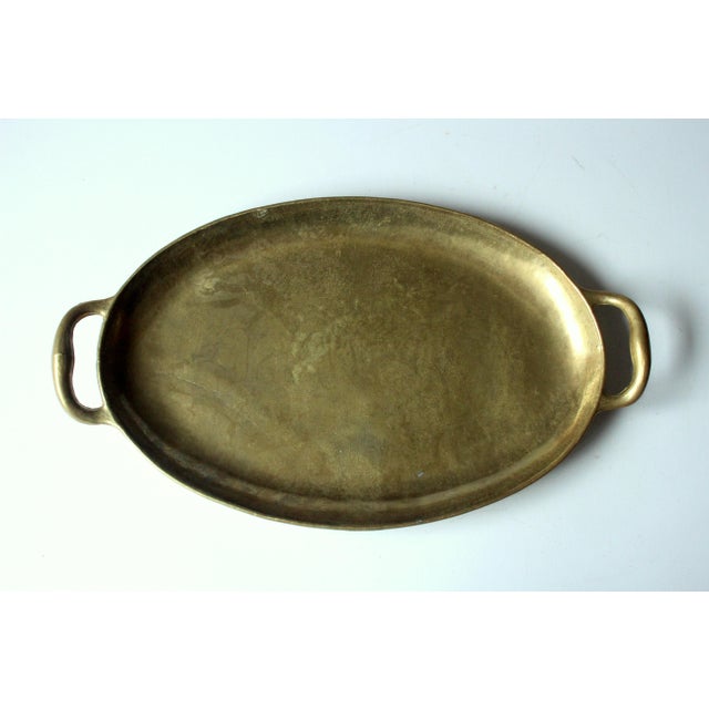 This solid brass serving tray dates from the 1960s and carries the maker's mark of Collini. The clear, handcrafted form...