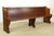 Reclaimed church pew bench made of oak with a dark tone finish, with traditional recessed carvings on each side. The bench...