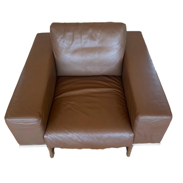 Mid- Century Modern Leather Chair in Dark Brown. Club chair, leather, chrome-plated steel, Designer is unknown. This easy...