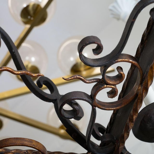 Rectangular wrought iron chandelier with golden twist trim details and original canopy.