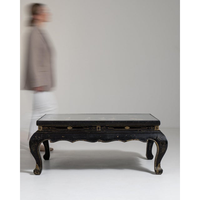 A coffee table whose black lacquer chinoiserie top, cabriole legs gives it real character at first glance. Originating in...