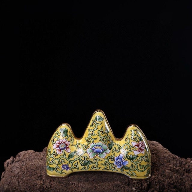 This exquisite antique Chinese brush rest is crafted in the form of a stylized mountain range, featuring a vibrant yellow...