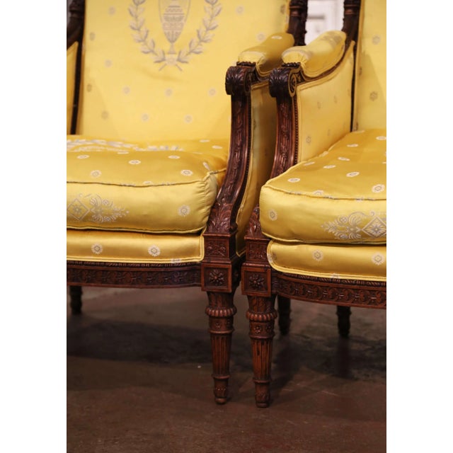 Yellow 19th Century French Louis XVI Walnut Bergères With Carved Eagle Crest For Sale - Image 8 of 12