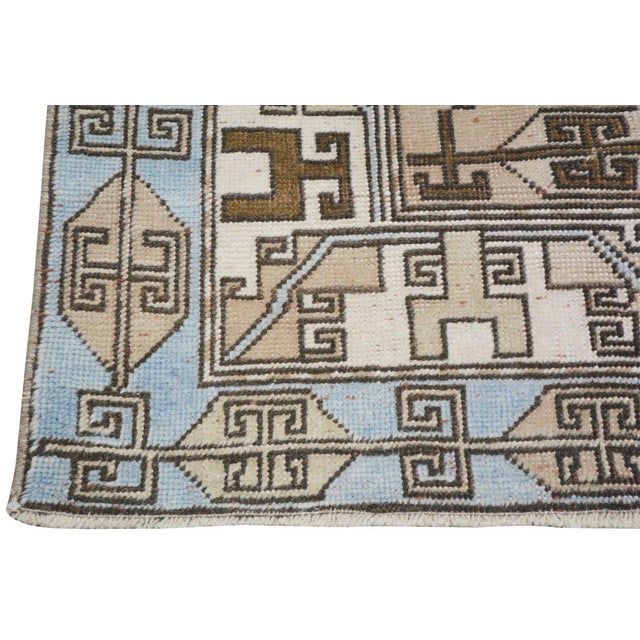 Hand-knotted with care using traditional rug-making techniques, this wool rug blends timeless craftsmanship with a modern...