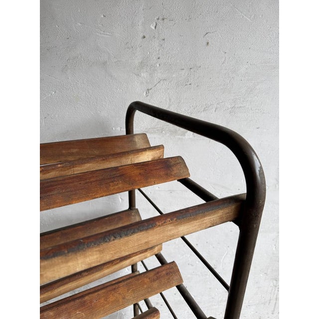 This unique bread rack from the Belgian interbellum period (circa 1930) is a beautiful example of functional design from...