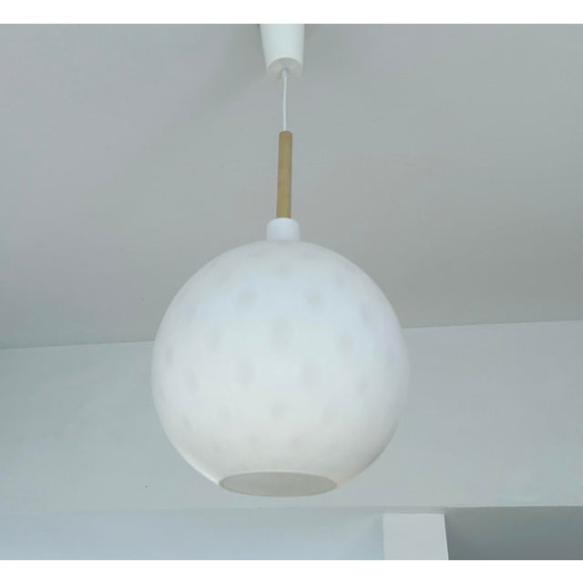 Very large mid century pendant light with a gourd shape glass shade with a semi translucent "golf ball" pattern, gilded...