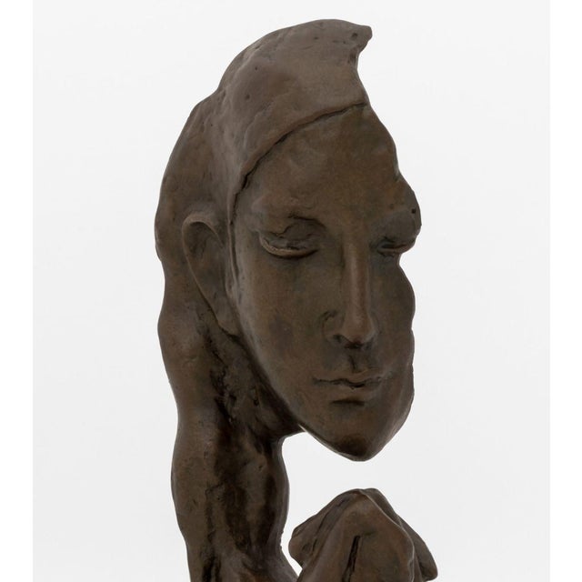 After Auguste Rodin Woman Praying Patinated Bronze Sculpture, bearing signature to base, atop a black marble socle....