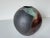 Striking 1993 studio pottery vase by Andrely Sarends, showcasing a bold and sculptural modernist form. This spherical...