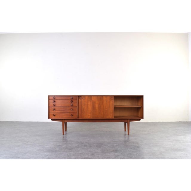 This teak sideboard was manufactured in the 60s by the Norwegian company Bruksbo. The furniture has been professionally...