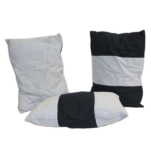 This is a set of 3 rectangular shape pillow cushions. It has a blue color mix with a graphic fabric cover - with a zipper....