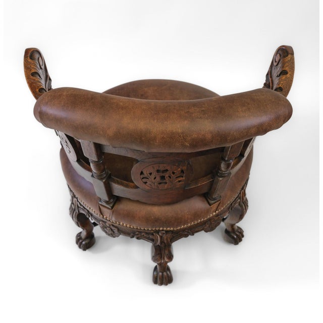 19th Century oak & leather Burgermeister armchair. English. Circa 1880. Of unusual form, this style of chair was...