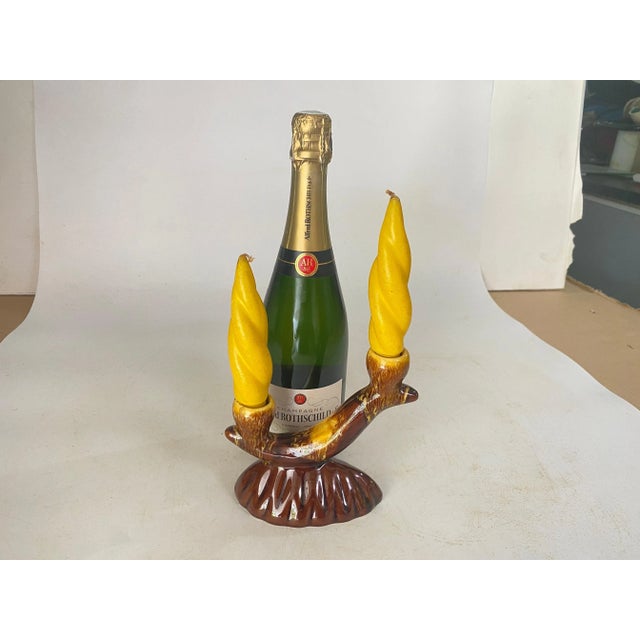 This is a pair of Candle Holder . It has been made in France circa 1970. The color is Brown. The size includes the candles...