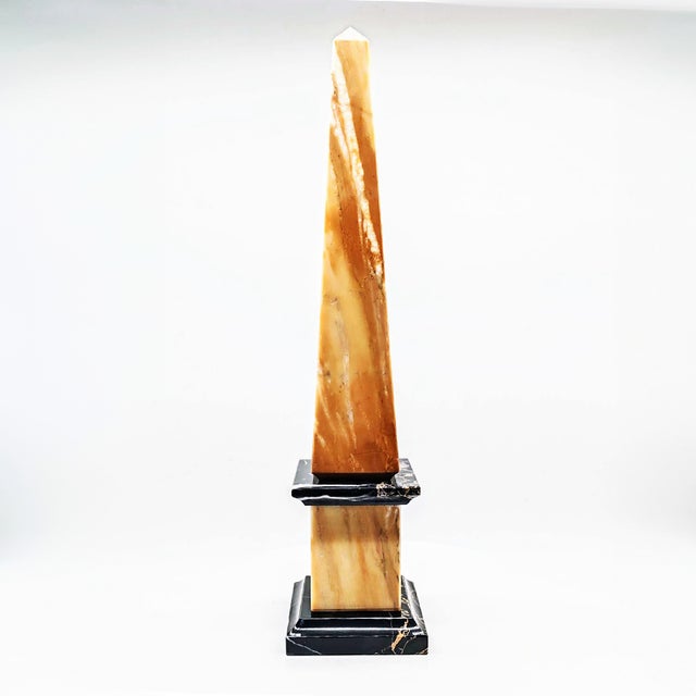 Large Obelisk in Hand Carved Yellow Marble of Siena and Black Marble of Portoro, Italy, 1970s , in Flawless conditions....