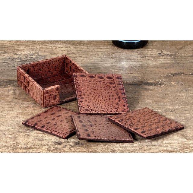Restoration Hardware ostrich embossed leather coaster set in a brown finish, including four square coasters and matching...