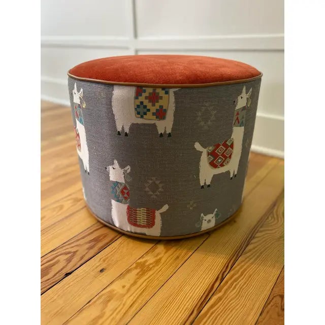 Custom Upholstered Ottoman in Kravet Chenille combined with a Billy goat motif & tan leather welting create a quirky &...