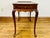 mahogany Queen Anne style tea table with a rectangular molded-edge gallery top, scalloped apron, pull-out drinks tray,...