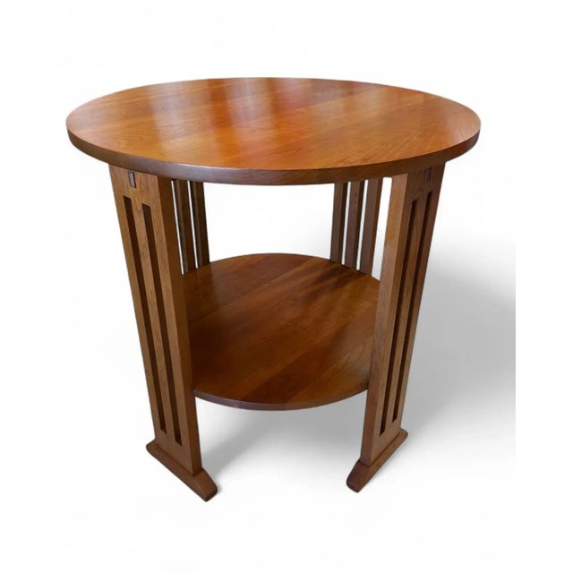 Mission style arts and crafts round side table from Stickley Furniture. This is an elegant occasional table with one fixed...
