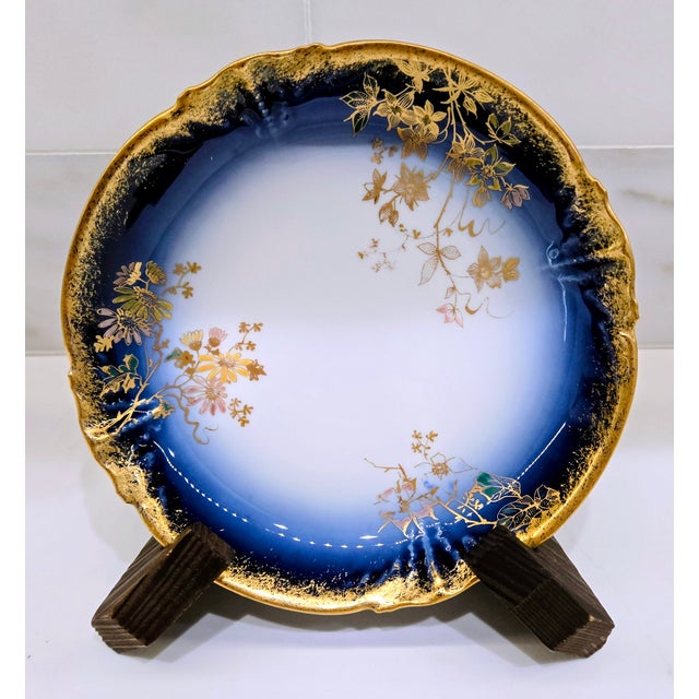 Elegant antique Limoges porcelain catchall dish by M. Redon, France, featuring deep cobalt blue borders, richly gilded...