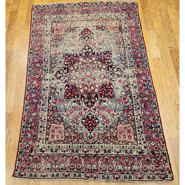 "Beautiful Persian Kerman Lavar area rug hand-knotted in the late 1800s. The rug features a beautiful and harmonious...