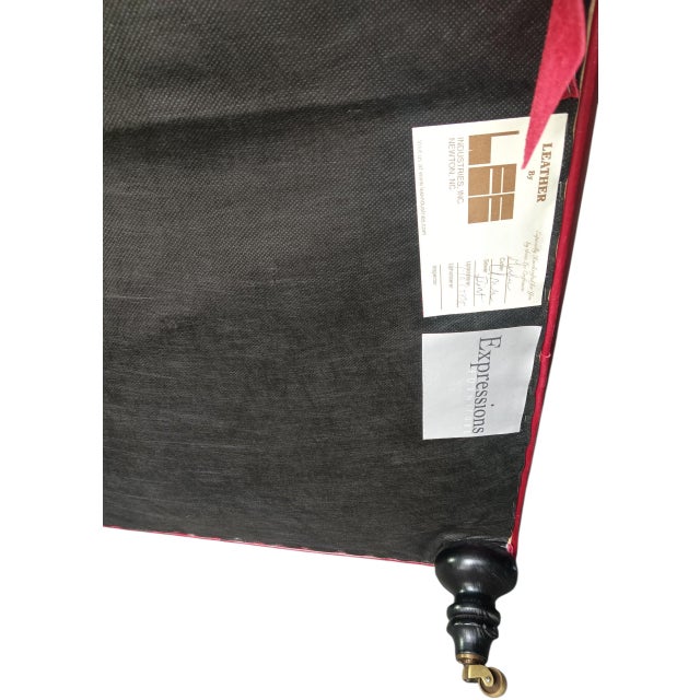 Discover the perfect blend of luxury and functionality with this stunning red leather ottoman by Expression. Crafted for...