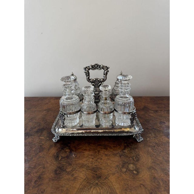 Wonderful quality antique Georgian seven bottle cruet set, having a quality antique Georgian cruet set, with a silver...