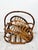 Vintage rattan magazine holder/basket. Leaf shaped rattan bamboo magazine holder with handle. Thick reeds with pencil reed...