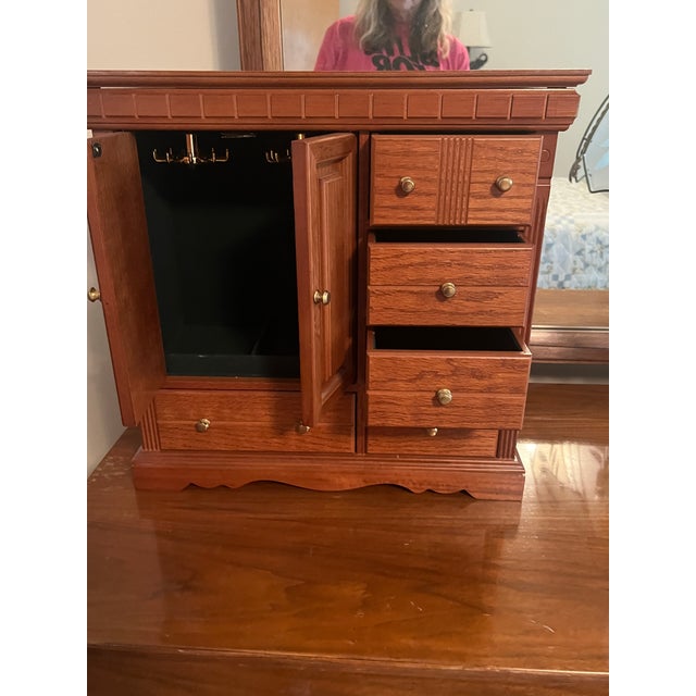 Keep your collection beautifully organized with this vintage 1980s–1990s tabletop wooden jewelry box armoire. Designed to...