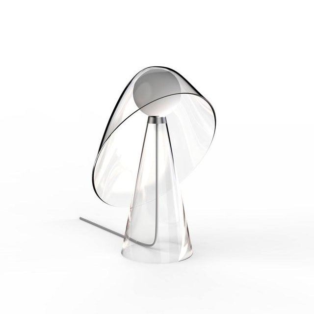 «Mademoiselle» is a crystalline lamp. The superposition of transparent elements sketches an evanescent silhouette. The...