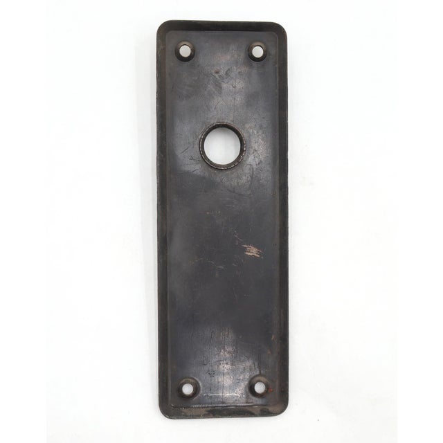 Vintage door back plate made of steel with a japanned finish. The original mounting screws are not available. Good...