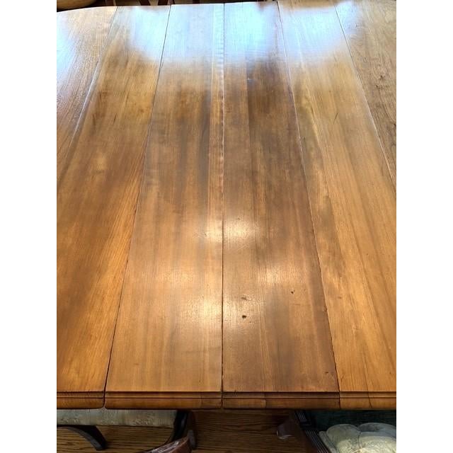 This is a wonderful dining room table, dating from the teens to 1920s. The leg style is known as Queen Anne. The photos...