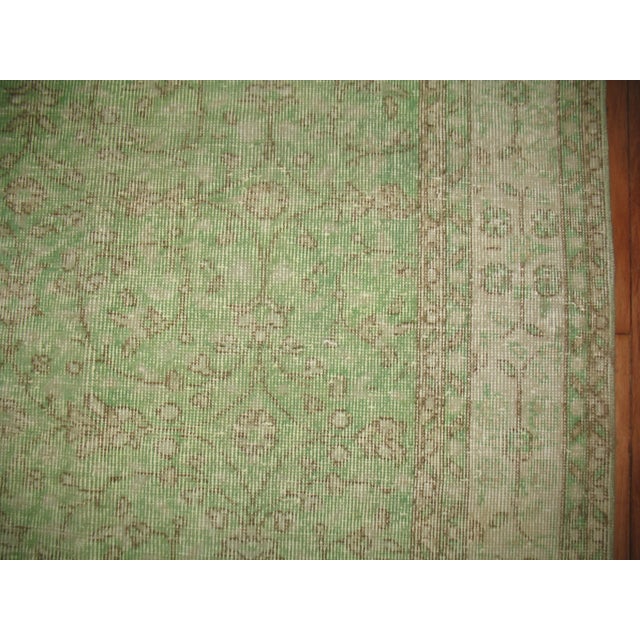 Room size allover motif Turkish over-dyed rug in mint green.