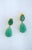 A stunning and relatively large pair of Chrysoprase drop earrings, circa early-21st century. Earrings feature faceted oval...