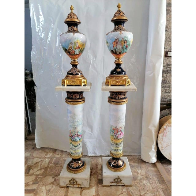 Bring a refined European elegance to your interior with this grand decorative vase and pedestal, featuring a soft palette...