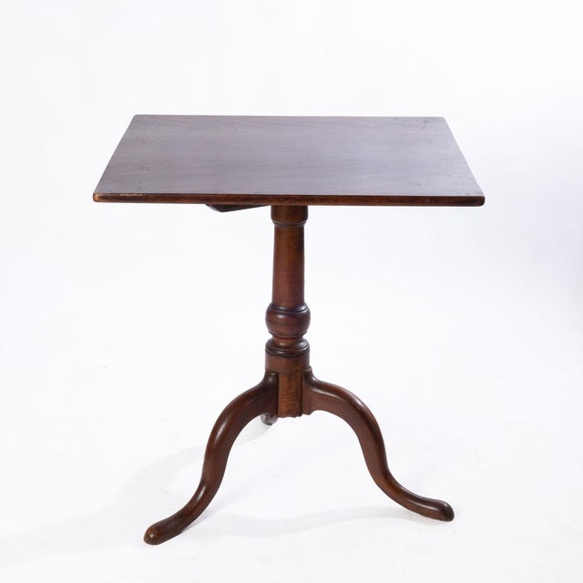 Early tilt top table. Sturdy and unique in the way that it sits on the legs. Great for everyday use or to put in a corner...